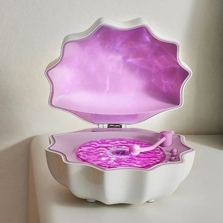 Enceinte Bluetooth décorative sans fil, lumière LED vagues pour créer une atmosphère de détente marine.