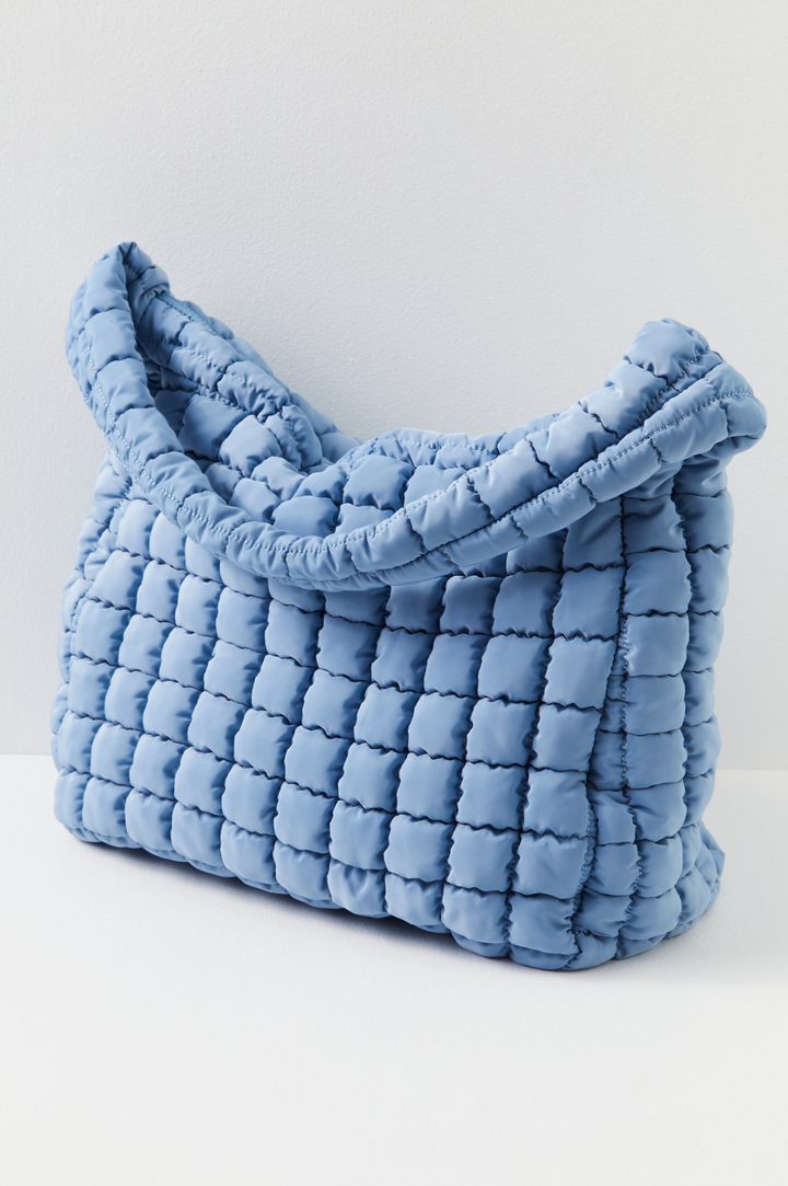 Sac matelassé vert femme, idéal pour le cadeau et l'organisation. Un accessoire mode déperlant pratique.