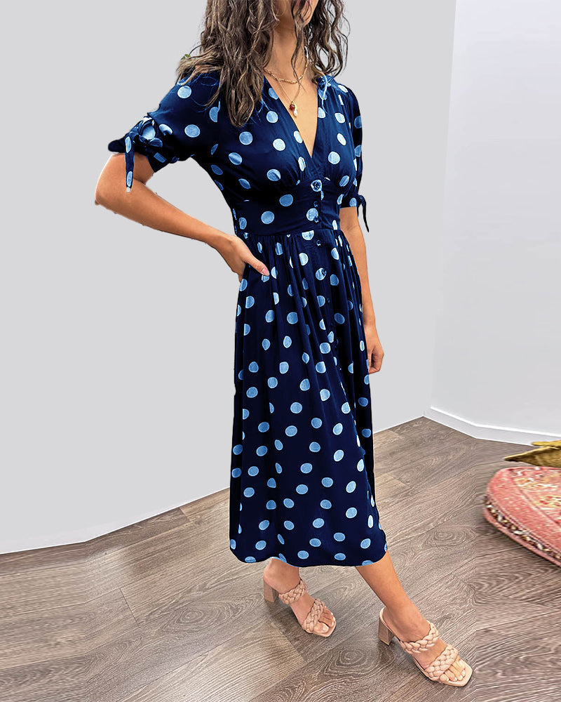 Robe midi fluide femme, motif pois tendance, pour un style chic et décontracté cet été.