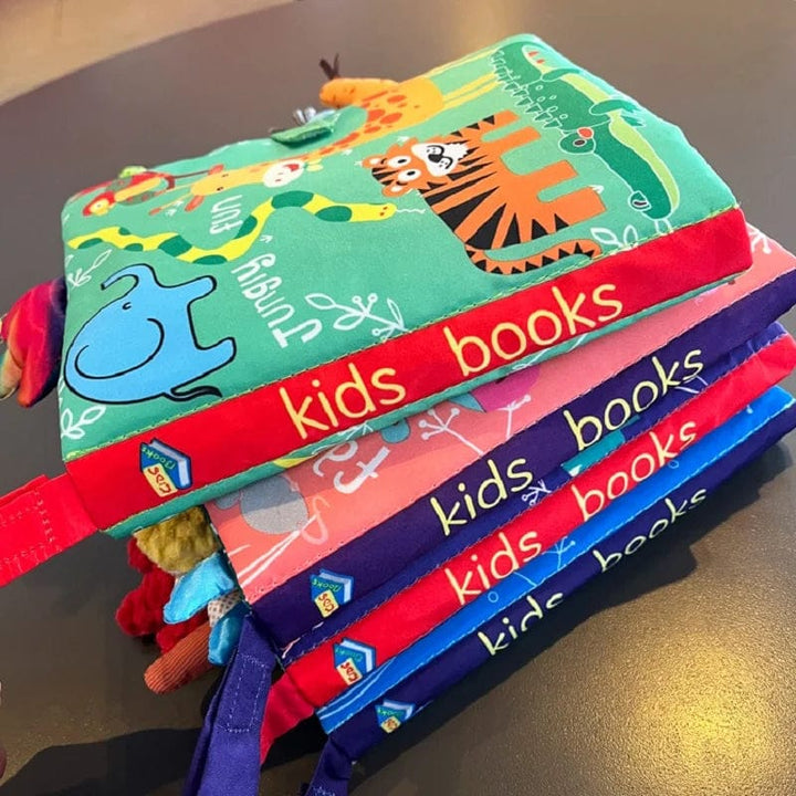 Livre tissu bébé avec pages froissées, textures variées et animaux joyeux pour stimuler l'éveil.
