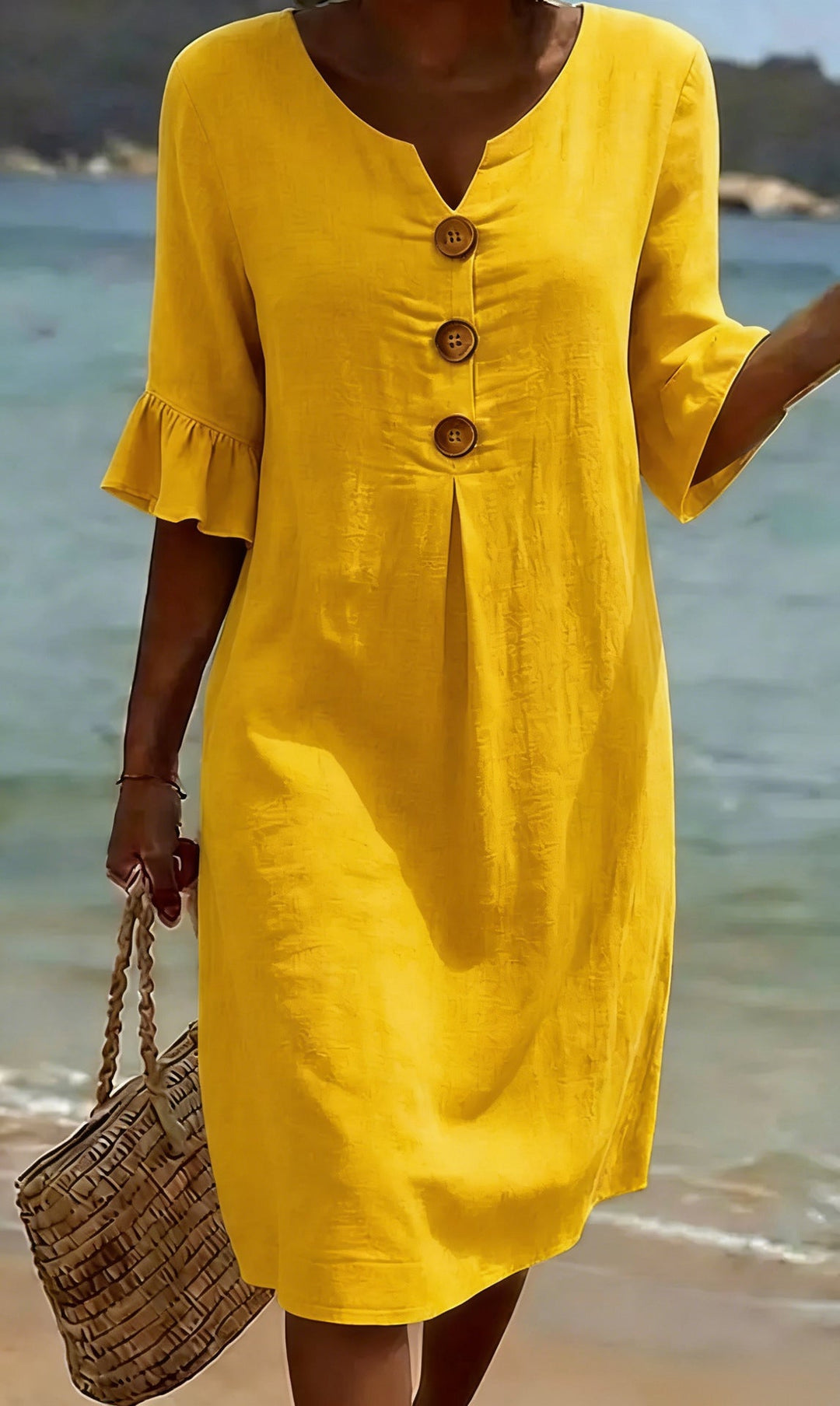 Robe femme élégante en coton lin, boutonnée, avec de jolies manches volantées. Parfaite pour l'été.