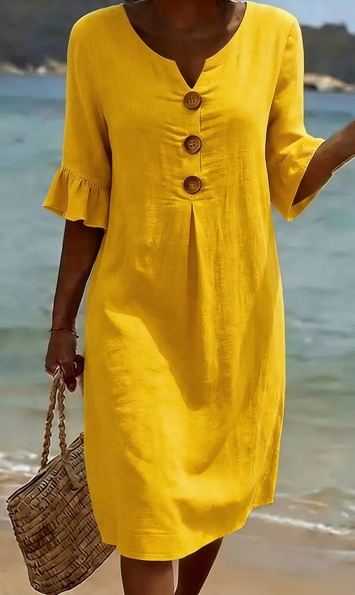Robe femme élégante en coton lin, boutonnée, avec de jolies manches volantées. Parfaite pour l'été.