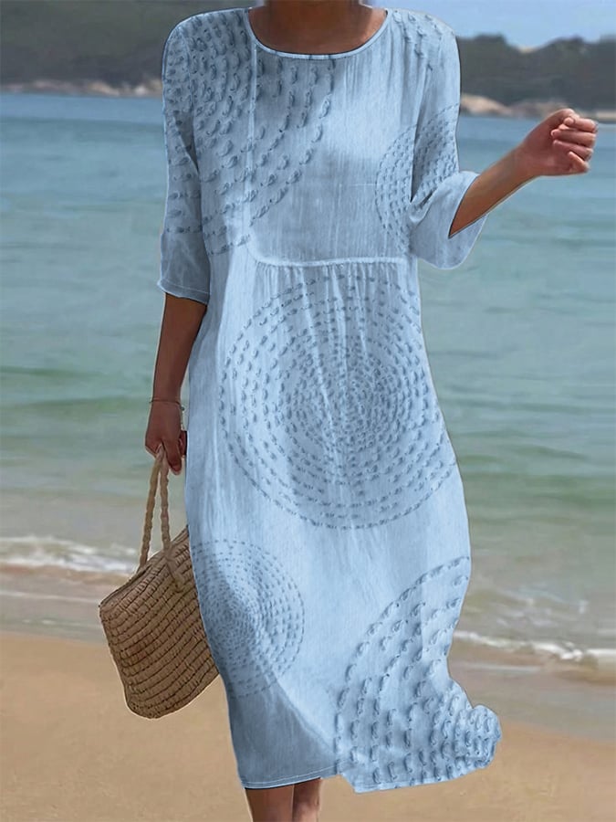 Robe midi femme chic et fluide en coton lin texturé, manches 3/4. Parfaite pour les vacances d'été confortables.