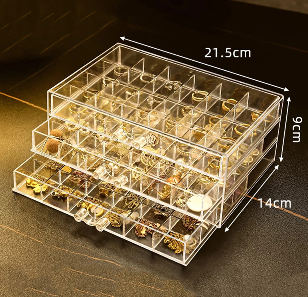 Organisateur de bijoux élégant en acrylique transparent multiniveaux pour boucles d'oreilles, bagues et colliers.