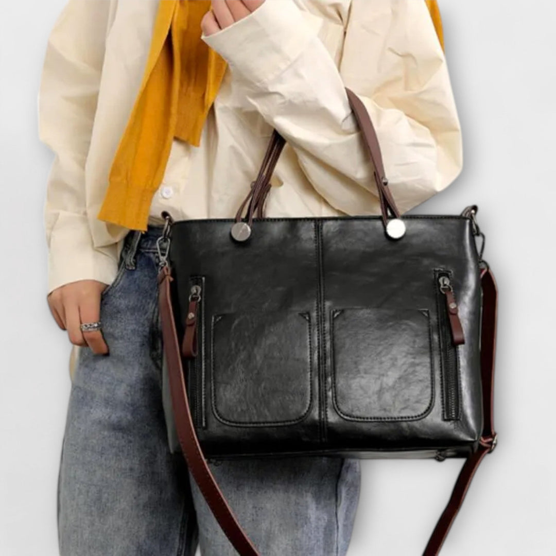 Sac à main femme élégant en cuir marron avec bandoulière amovible. Un accessoire mode polyvalent et pratique.
