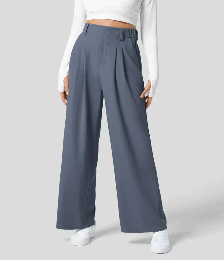 Pantalon femme fluide et large, taille haute, confortable. Élégance décontractée pour toutes occasions.