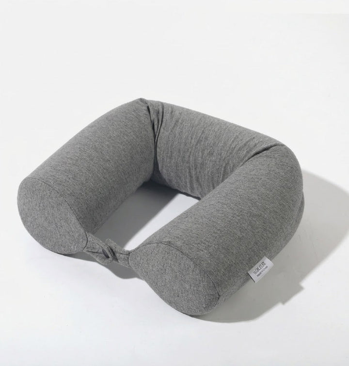 Oreiller de voyage ergonomique offrant un confort nuque maximal pour des voyages relaxants.