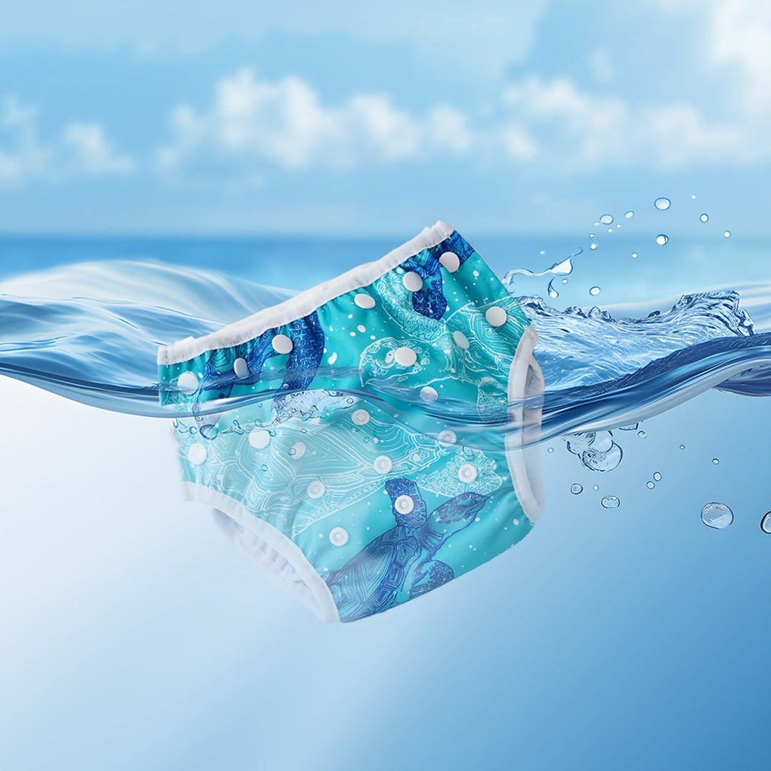Maillot de bain bébé imperméable réglable, motif poisson coloré. Parfait pour nager et jouer.