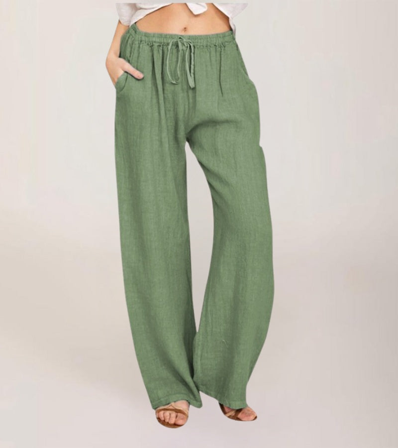 Détail du tissu léger d'un pantalon large femme en lin, taille haute, confort décontracté d'été.