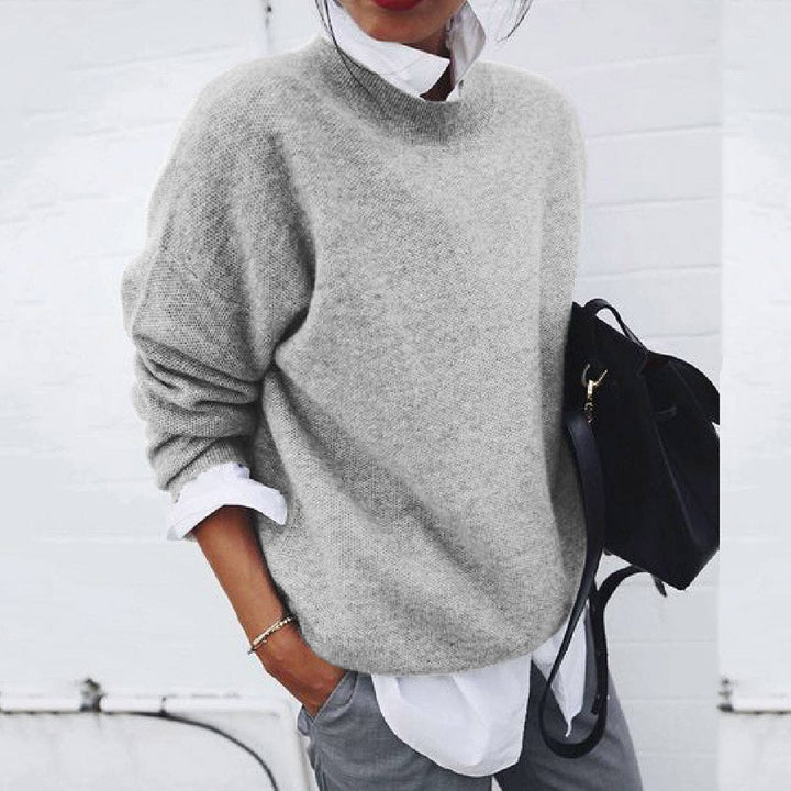 Pull élégant femme, texture douce, col rond confortable. Parfait chandail chic pour l'hiver et la mode décontractée.
