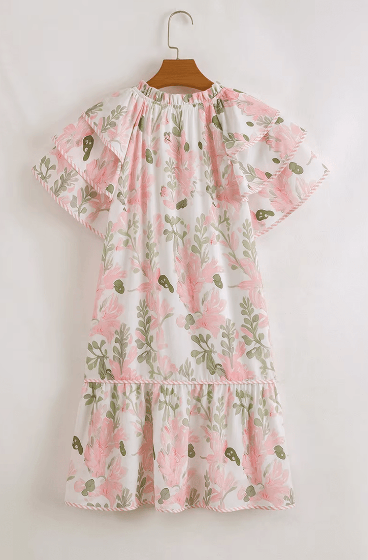 Élégante mini robe femme Aura rose et bleue, design floral et rayures. Un look chic et confortable pour l'été.