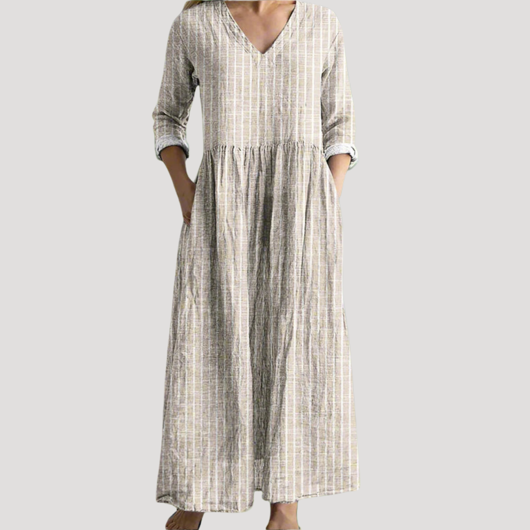Robe longue fluide femme à rayures, avec un col en V et des poches, offrant confort et style casual estival.