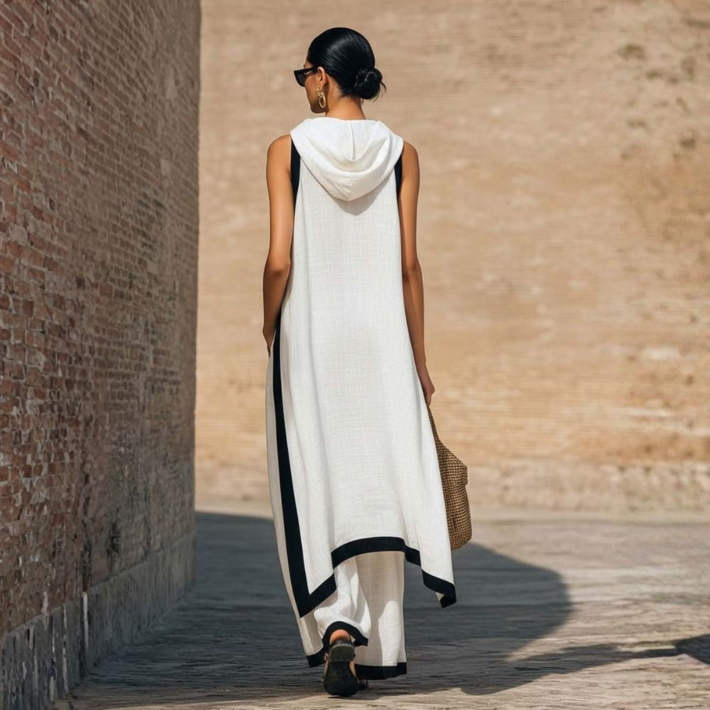 Gros plan sur le tissu lin coton doux d'une tenue femme, ensemble tunique asymétrique et pantalon large.