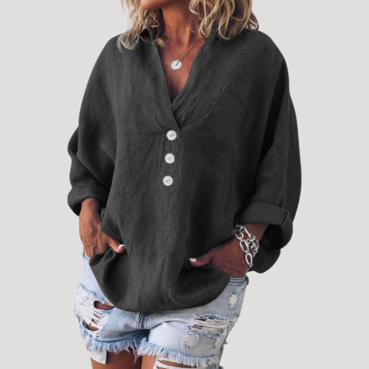 Blouse femme basique chic et confortable, détail boutonné, parfaite pour la mode féminine.