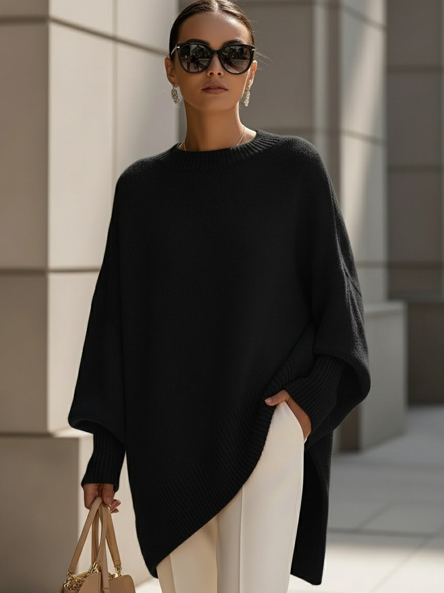 Ce poncho oversize apporte une touche d'élégance à toute tenue femme, confort et style assurés.