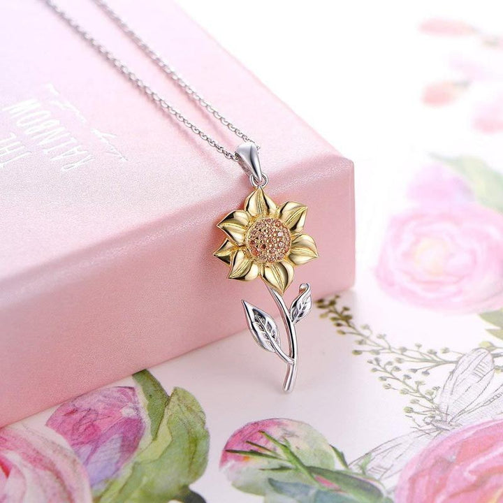 Collier tournesol doré éclatant pour femme. Pendentif élégant, idéal bijoux mode.