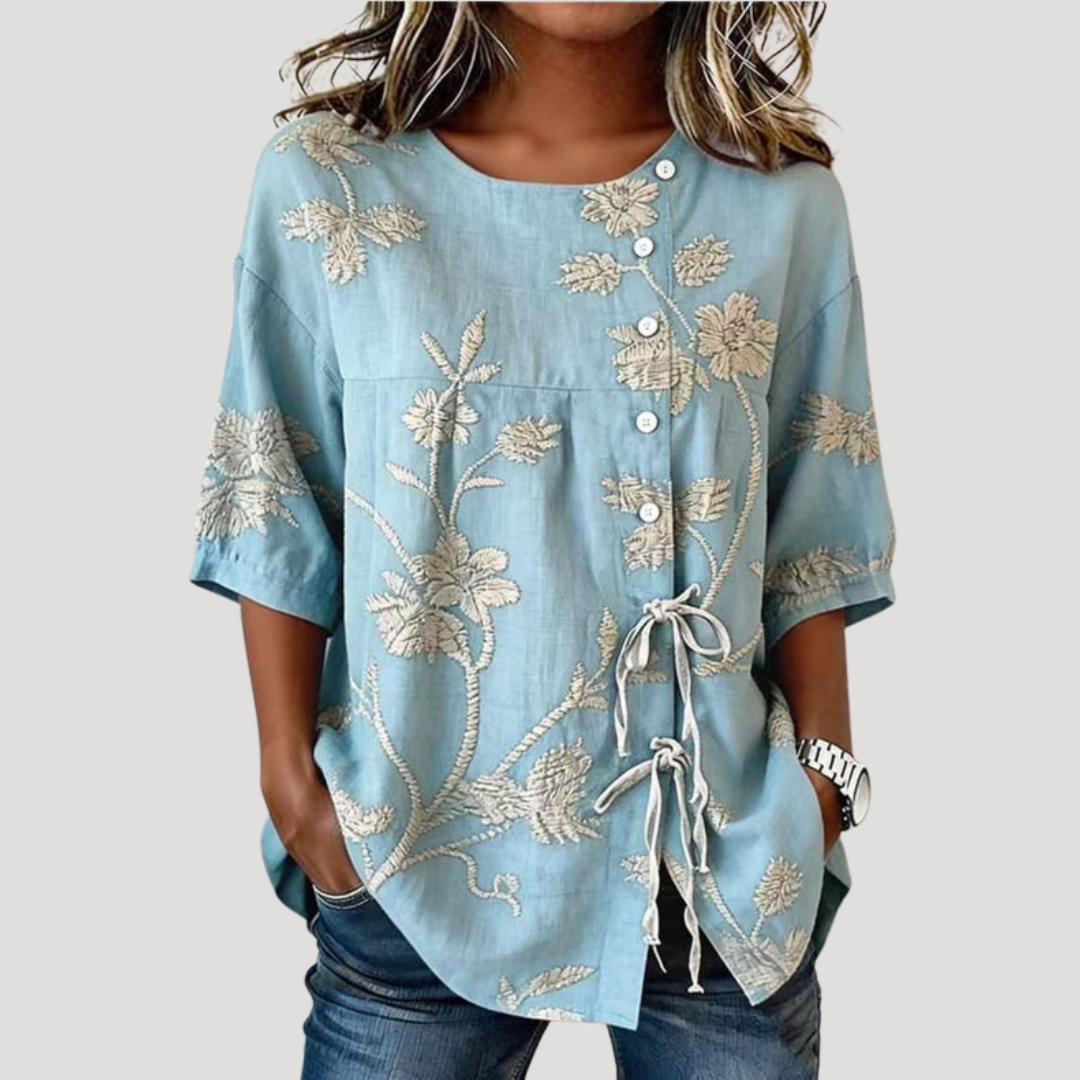 Blouse femme fleurie bohème manches courtes, style élégant et décontracté. Parfaite pour l'été.