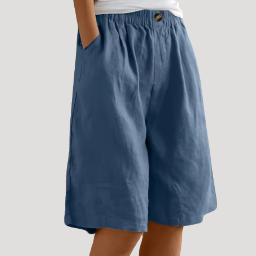 Bermuda femme polyvalent, taille élastique et coupe ample. Idéal pour un look chic ou décontracté en été.