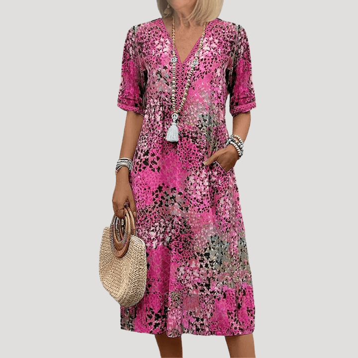 Robe midi fleurie style bohème chic femme, coupe élégante et décontractée. Idéale pour le printemps et l'été. Très confortable.