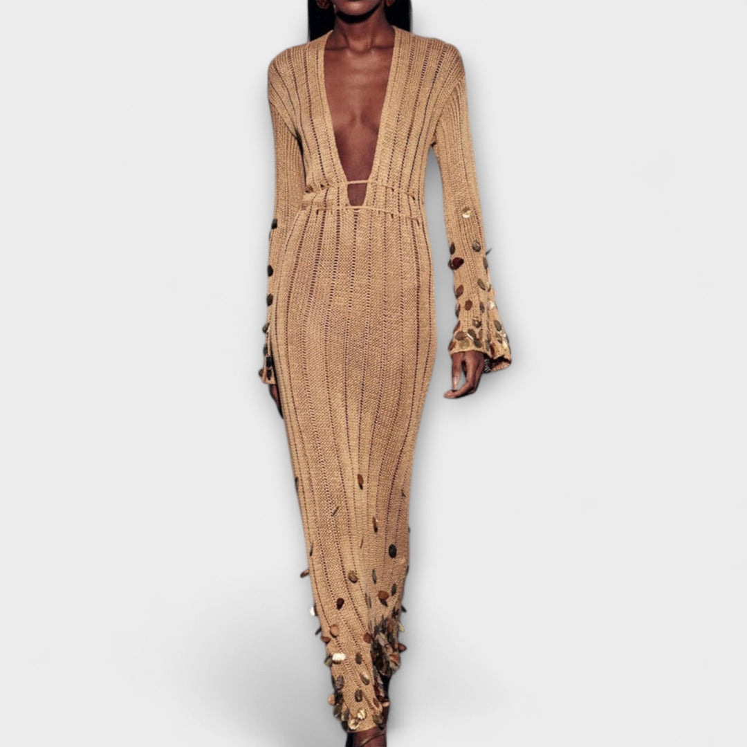 Robe maxi femme dorée, tissu scintillant, coupe élégante et longue, pour un style de soirée incomparable.