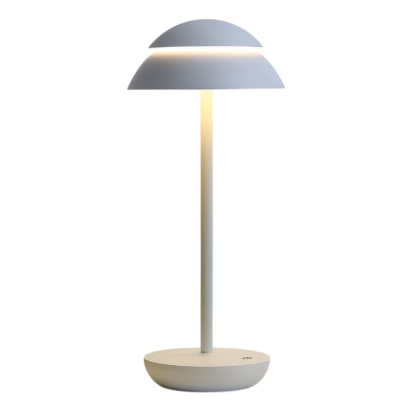 Lampe de table design créant une ambiance chaleureuse avec sa lumière douce, rechargeable et sans fil pour l'intérieur.
