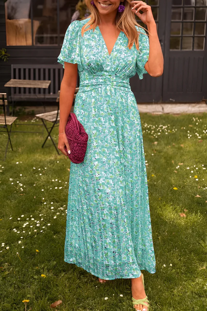 Robe femme fleurie Elisa, fluide et légère, idéale pour les vacances d'été. Un style élégant et décontracté.
