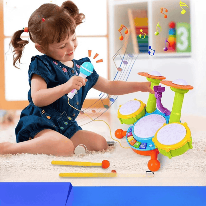 Cadeau idéal : batterie musicale lumineuse pour enfants avec micro. Favorise l'apprentissage, la coordination et l'éveil.