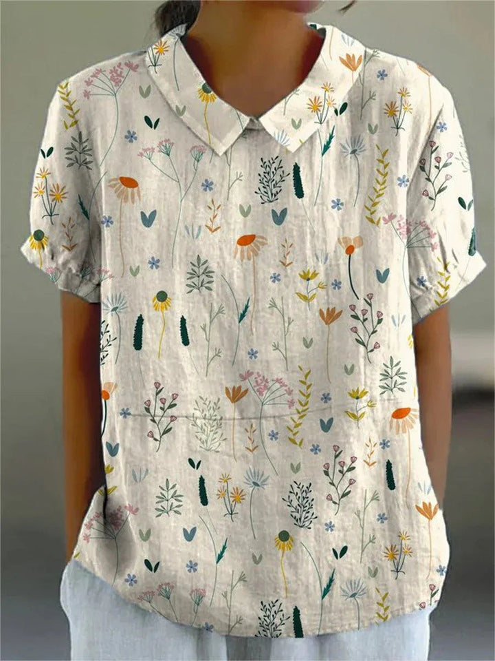 Blouse femme légère à manches courtes, imprimé fleurs sauvages multicolores, idéale pour l'été et le printemps.