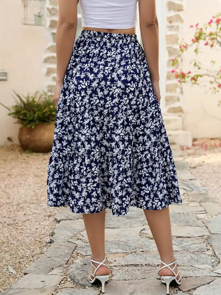Bas femme: jupe évasée à fleurs avec poches, parfaite pour un look printemps-été décontracté.
