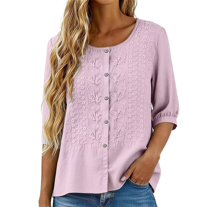 Blouse femme, design floral brodé, manches 3/4. Un vêtement polyvalent pour toute saison.