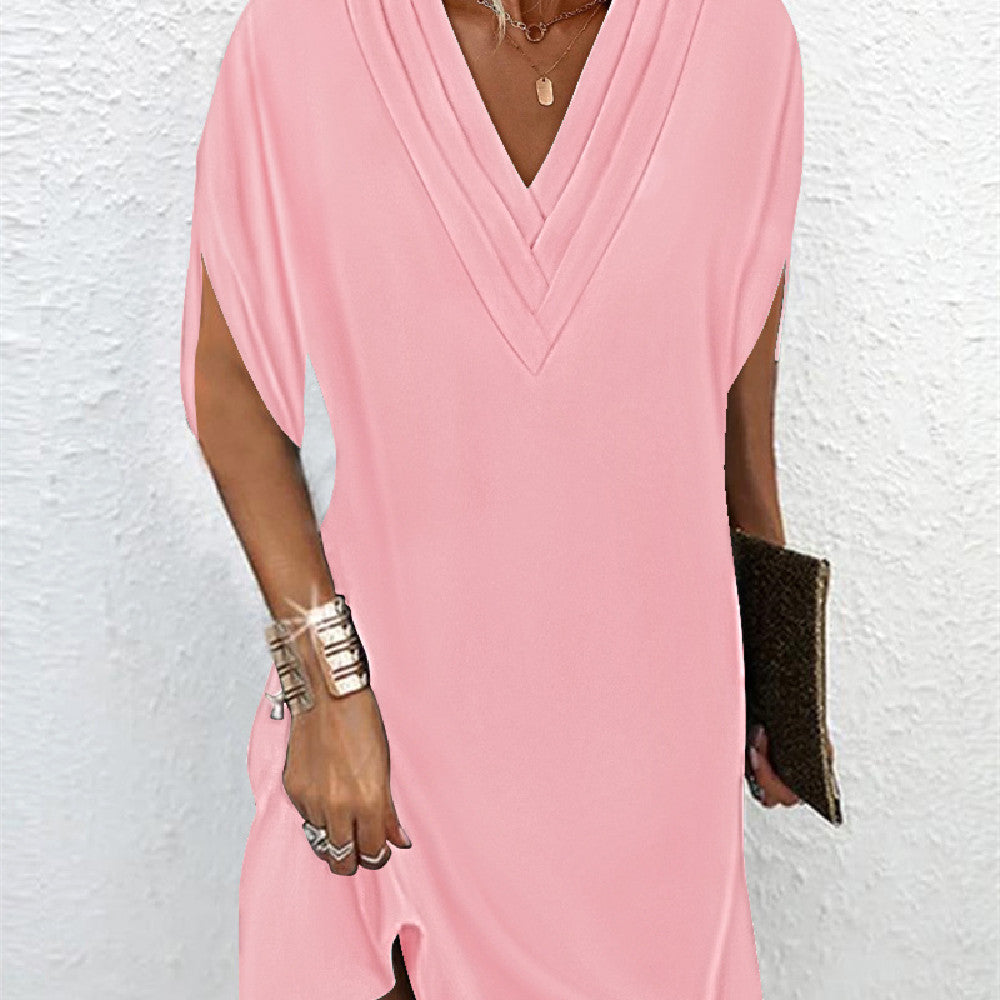 Blouse femme chic et élégante à manches fendues, idéale pour un look professionnel ou festif.