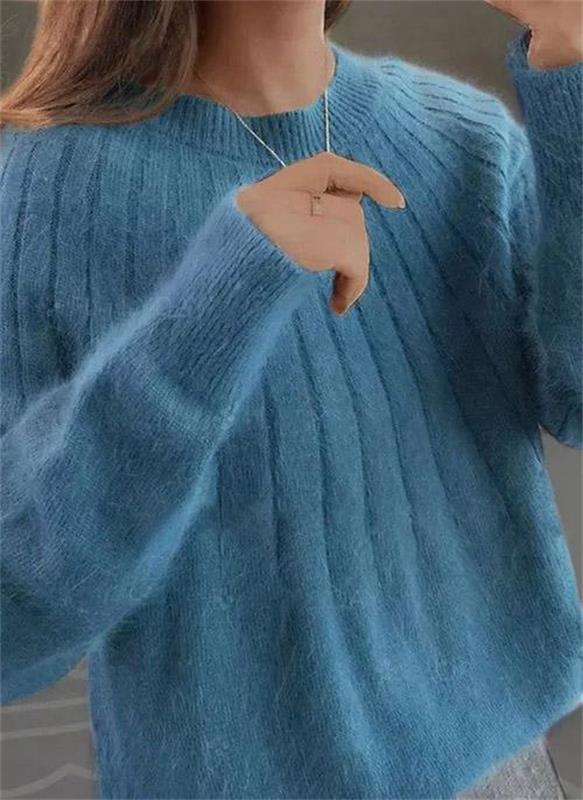 Pull femme en maille douce, coupe décontractée élégante. Idéal automne/hiver pour un confort chic et moderne.