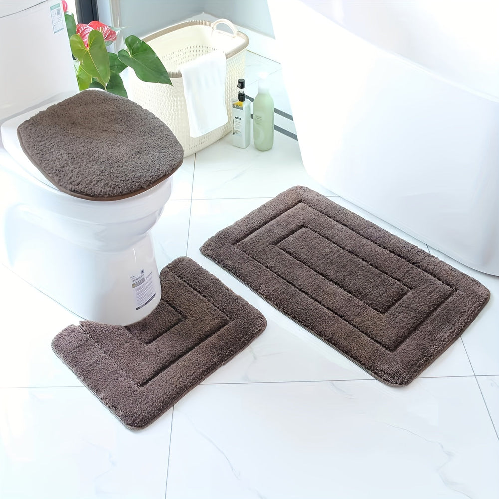 Tapis de salle de bain doux en fibres ultra-fines, super absorbant et lavable en machine, pour un confort optimal.