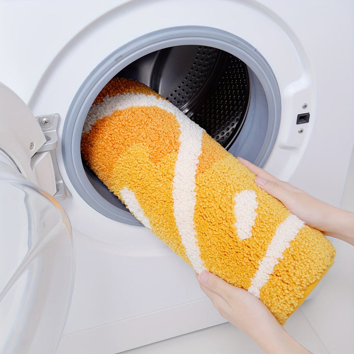 Tapis de douche doux et moelleux, motif orange pétillante, pour une salle de bain gaie.