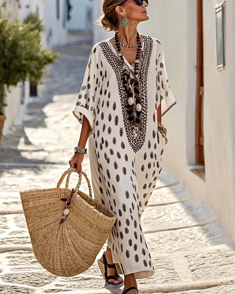 Robe kaftan maxi femme fluide, broderie ethnique et pois. Idéale pour l'été chic et bohème.