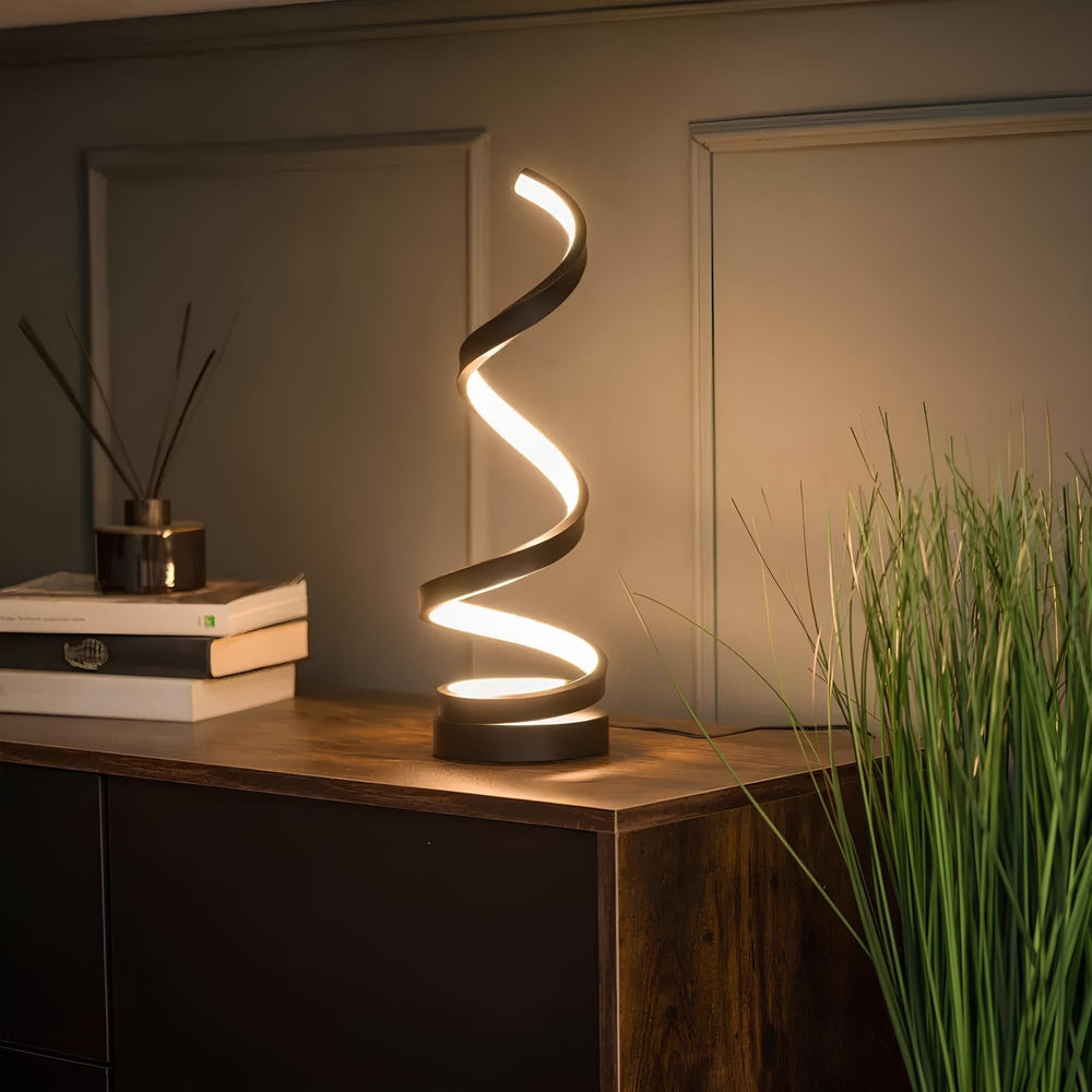 Lampe LED spiralée rechargeable, design moderne, 3 niveaux de lumière. Idéale pour chevet ou décoration intérieure.