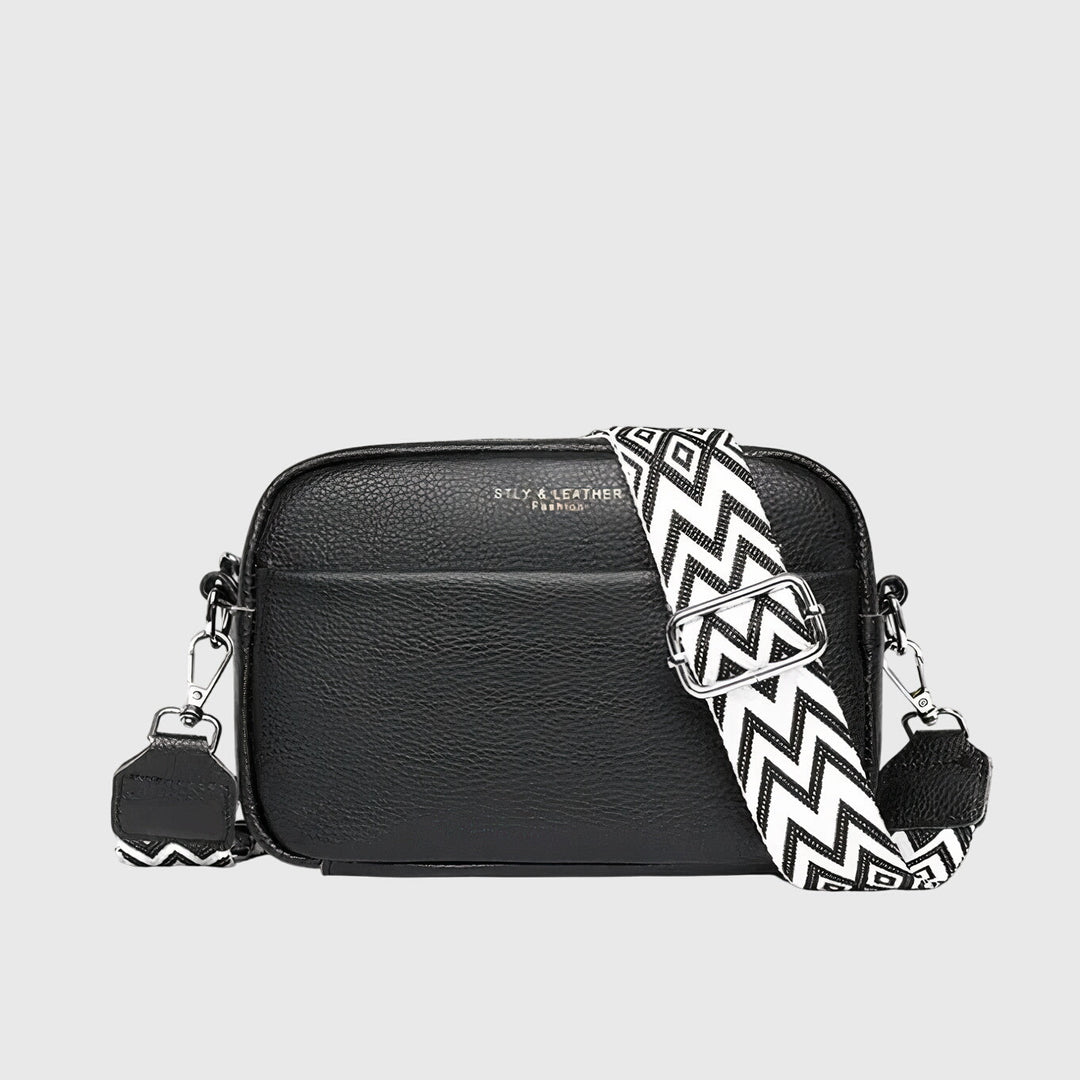Sac bandoulière cuir noir femme, élégant et chic, parfait pour un look quotidien moderne.