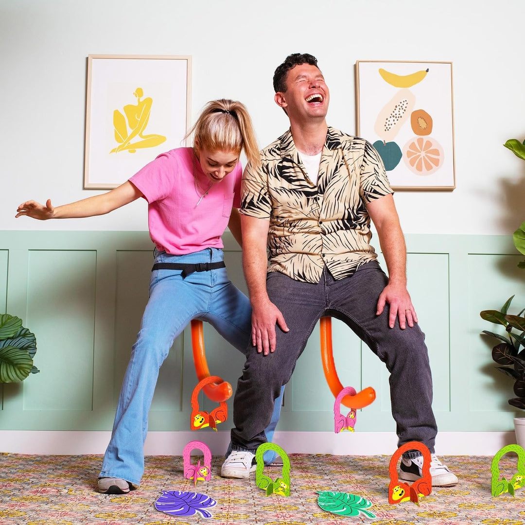 Famille multigénérationnelle unie autour du jeu Swingo Actif. Divertissement pour tous les âges.