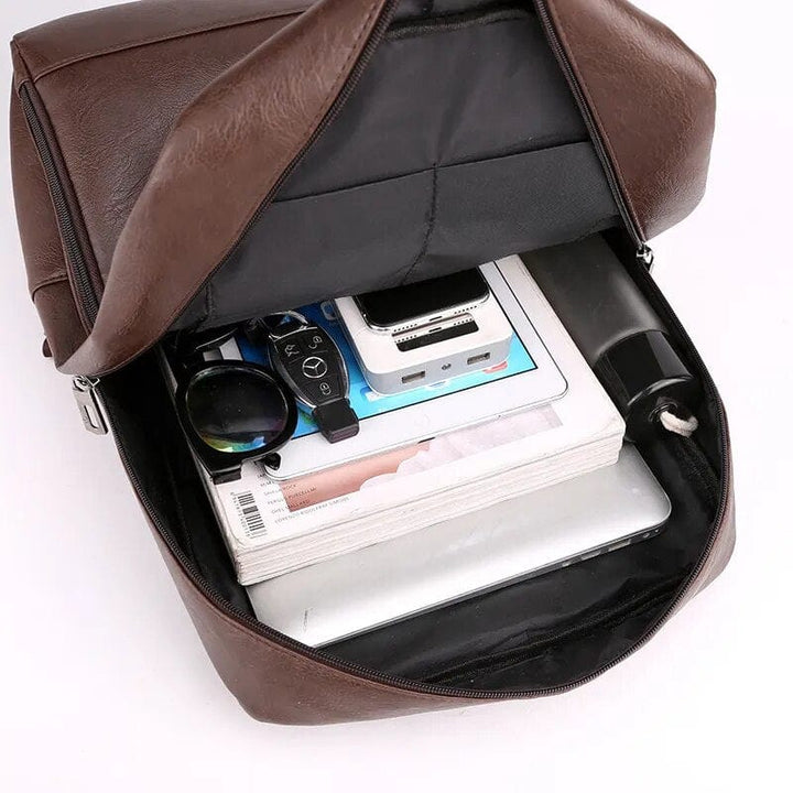 Sac à dos homme en cuir PU imperméable, robuste et élégant. Idéal pour travail, voyage et quotidien.