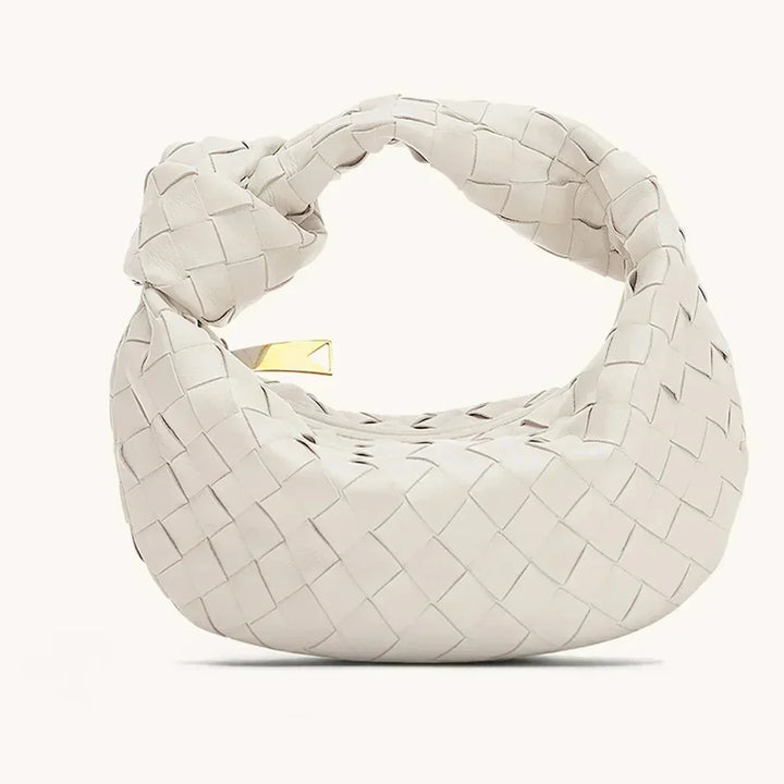 Sac à main en cuir véritable pour femme. Accessoire mode chic et polyvalent, résistant et classique.