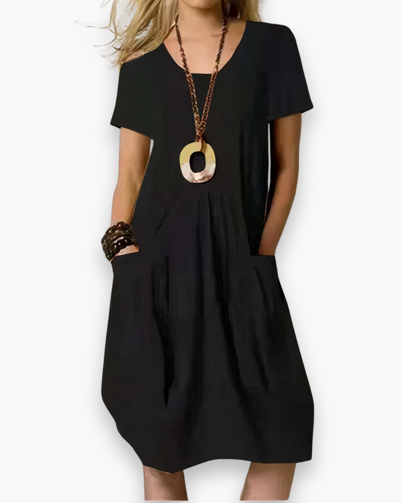 Robe midi femme ample et polyvalente, parfaite pour un look tendance et confortable au quotidien ou en été.