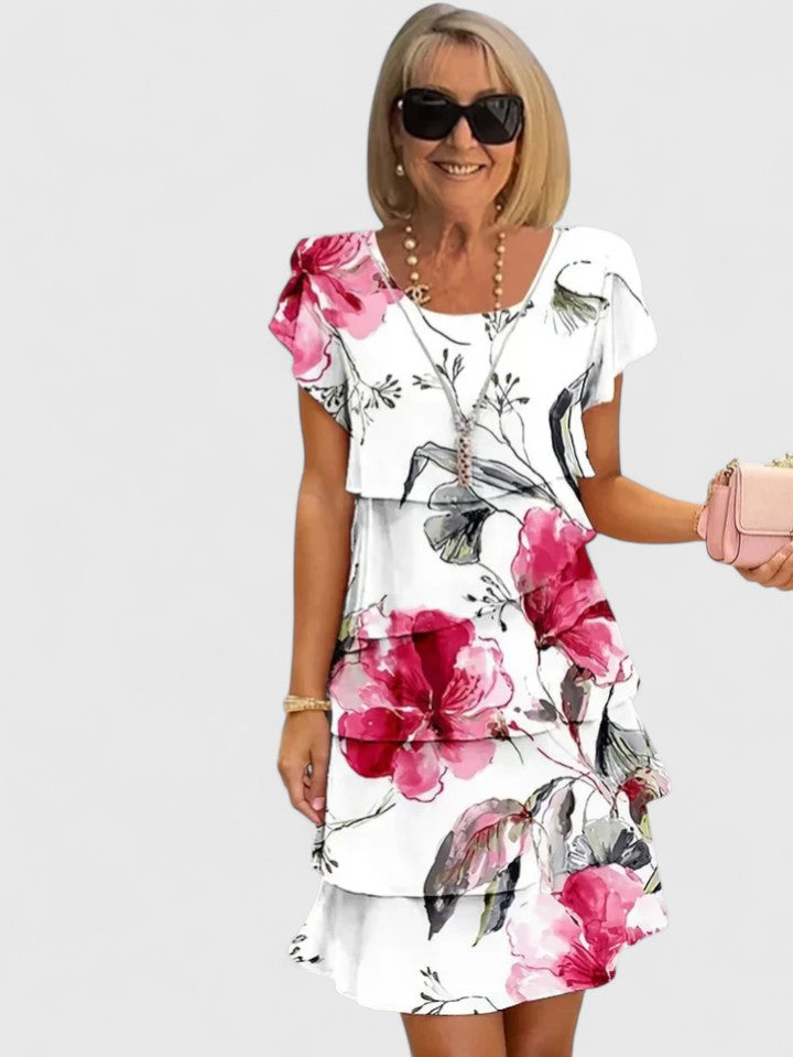 Élégante robe longue fleurie pour femme, tenue de soirée chic et estivale, avec volants et un confort optimal.