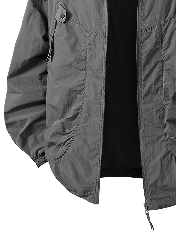 Veste de protection extérieure, résistante aux intempéries, avec capuche confortable.
