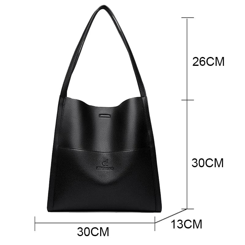 Élégant sac fourre-tout en cuir vegan noir et marron, idéal pour un look quotidien chic.