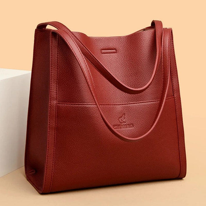 Sac cabas mode multi-couleur en cuir vegan pour femme, accessoire stylé et pratique.