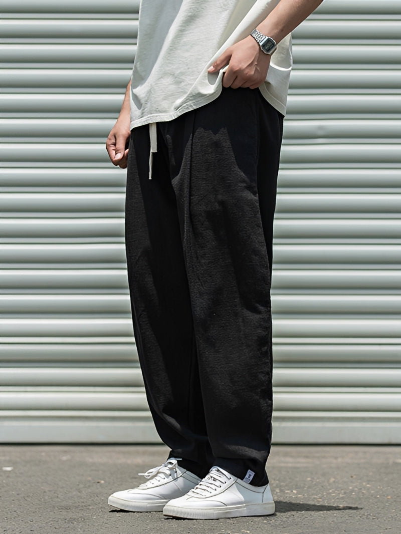 Pantalon homme mode masculine, coupe ample et confortable. Idéal pour un style décontracté, le quotidien et l'été.