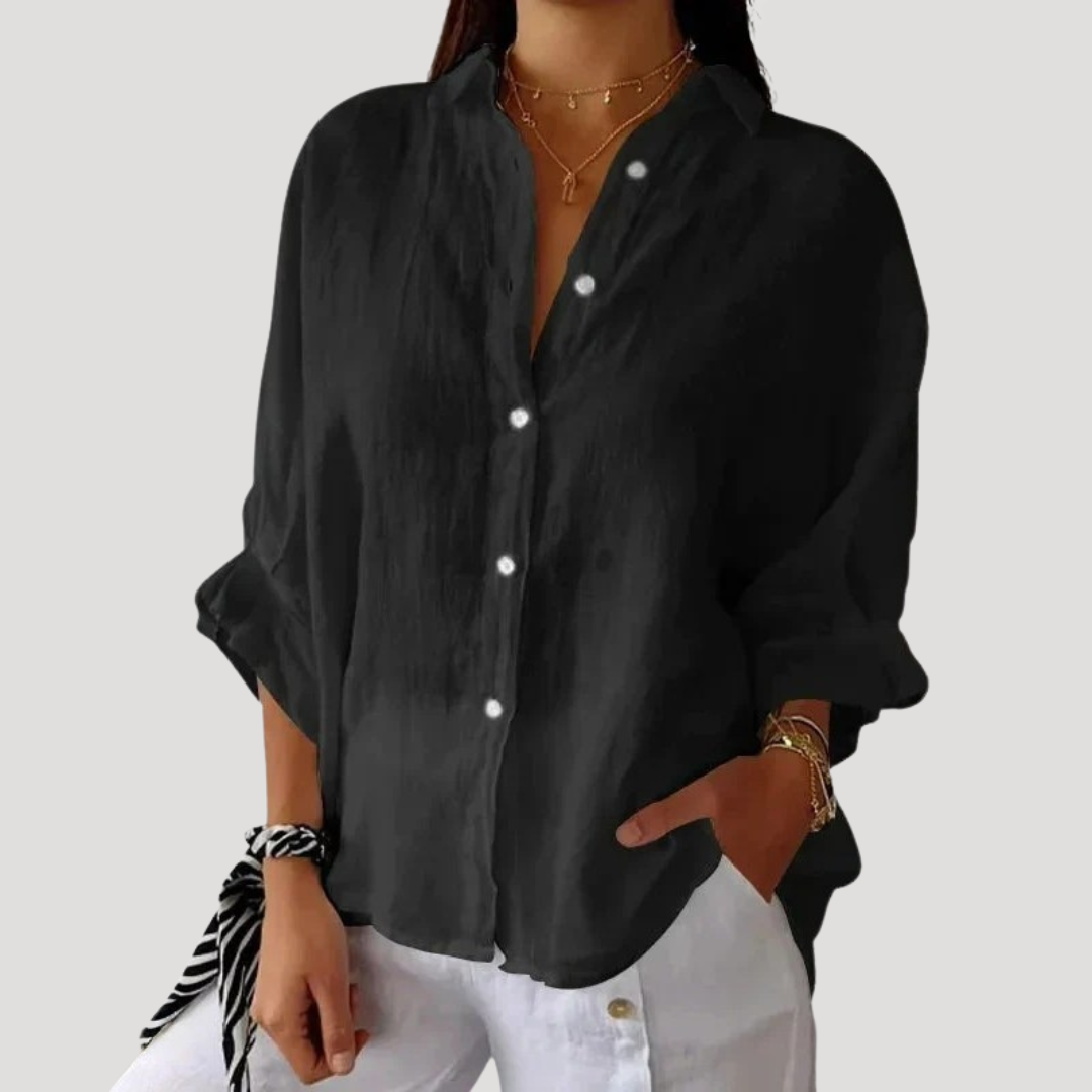 Blouse chic et fluide pour femme, coupe ample et manches longues, idéale pour un style quotidien.