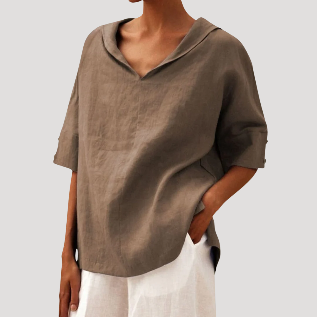 Blouse ample femme à col ouvert et manches courtes. Vêtement décontracté et fluide pour tout type de tenue.