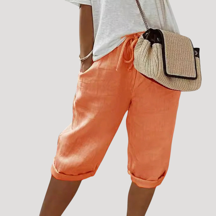 Short femme élégant, taille haute élastique, coupe ample, parfait pour la détente et le confort.