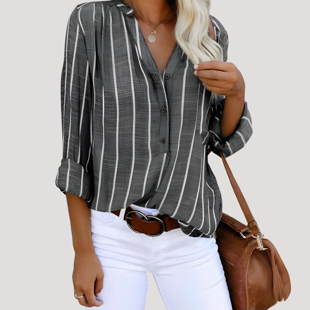 Élégante chemise femme rayée manches longues, idéale pour mode printemps/automne. Blouse chic et décontractée.